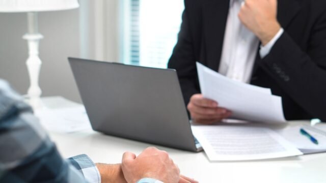 1781364000_0_Job-interview-or-meeting-with-bank-worker-in-office-Business-man-considering-Discussion-about-loan.jpeg