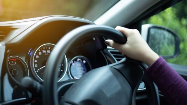 1781596372_3_hands-on-steering-wheel-on-the-right-with-country-side-view.jpg