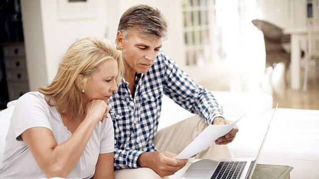 13_Couple-checking-claim-form.jpg