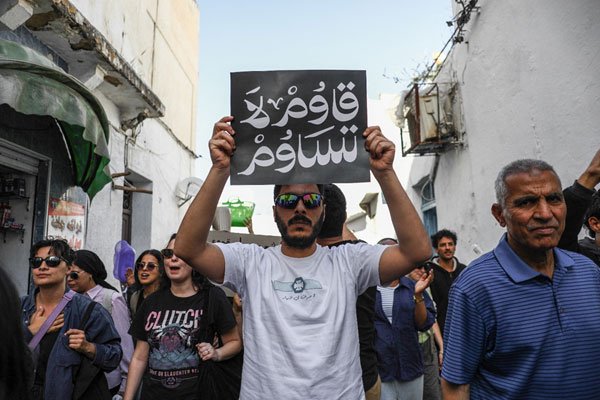 1782892854_A-protester-holds-up_.jpg