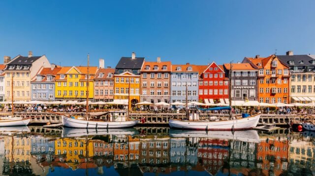 1783365060_0_Multi-colored-vibrant-houses-along-Nyhavn-harbour-on-a-sunny-day-with-clear-blue-sky-Copenhagen-De.jpeg